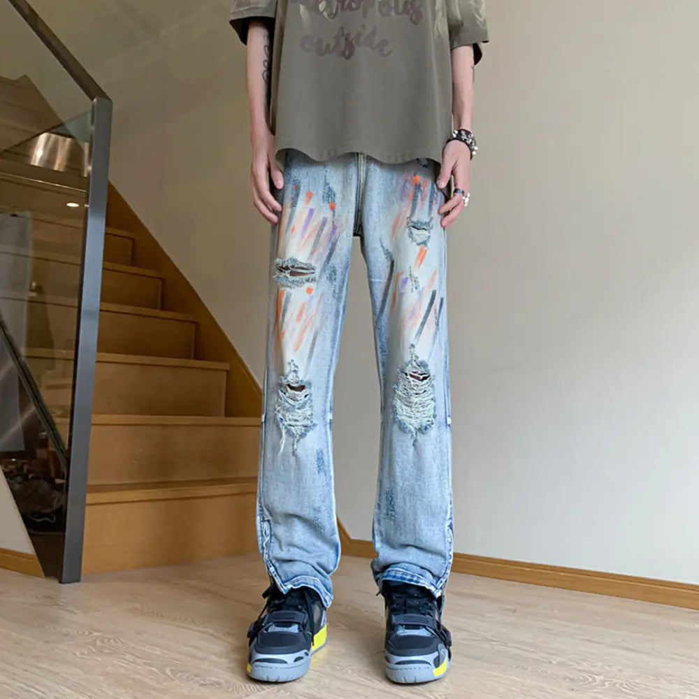 Jeans Desgastados con Salpicaduras de Pintura y Puños con Cremallera