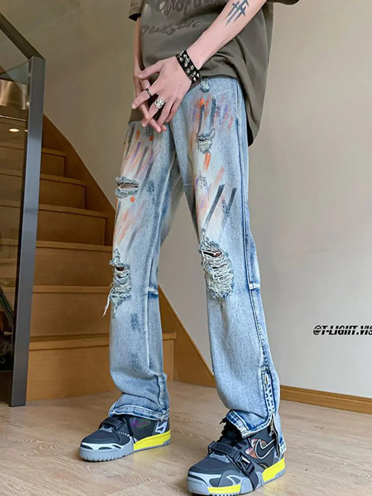 Jeans Desgastados con Salpicaduras de Pintura y Puños con Cremallera