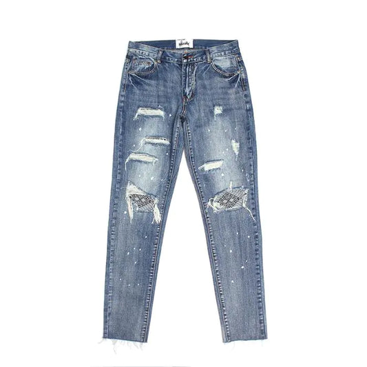 Jeans de Mezclilla Distressed con Parches en las Rodillas y Salpicaduras de Pintura